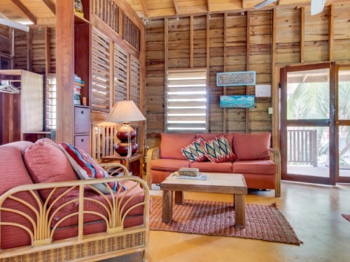 Comfy Bedroom Featuring Traditional Belizean Shutters and Hardwood Furniture Comfy Bedroom Featuring Traditional Belizean Shutters and Hardwood Furniture